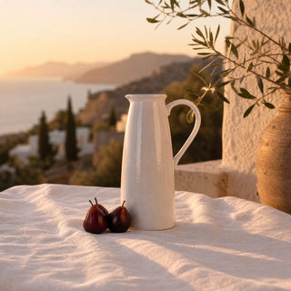 Faux figs and the Watermill Jug on a linen covered table on a Mediterranean terrace