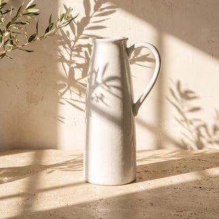 The Watermill Jug showing its gently curved form and pale white grey glaze