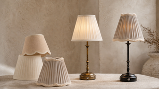 Three table lamps with different lampshades on a textured surface.