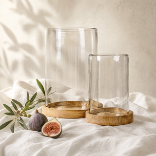 The Haven Wood and Glass Candle Holder styled on a softly draped white linen tablecloth