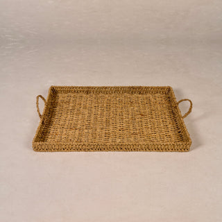 Woven Seagrass Rectangular Tray with braided handles shown at an angle