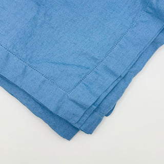 Signature Pure Linen Tablecloth in Amalfi Blue showing its soft drape
