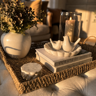 Woven Seagrass Rectangular Tray with lemons and olive stems in low evening sunlight